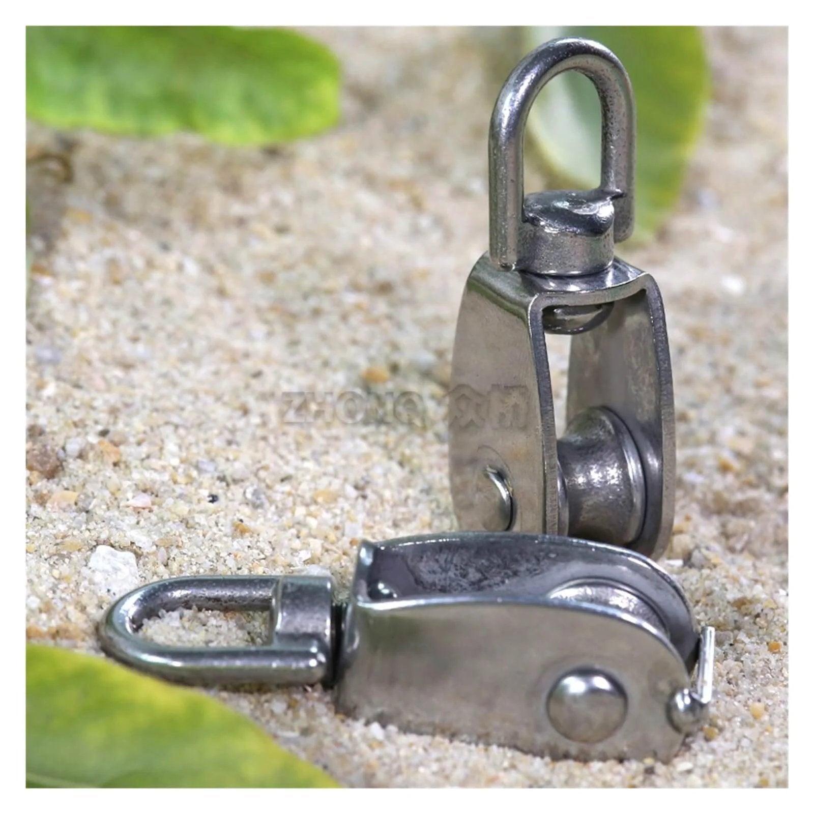 Stainless Steel Pulley M15 Single Wheel Swivel Lifting Rope Pulley Set Lifting Wheel Tools(M15) on sand surface