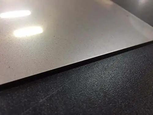Close-up of Three Sixteenth Inch Thick 6 By 12 Inch 304 Stainless Steel Plate 7 Gauge Laser Cut Grey for welding and fabrication projects