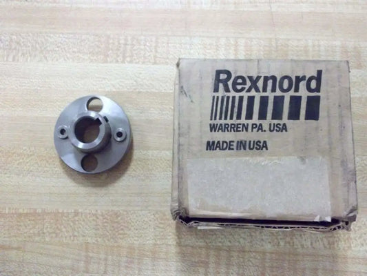 DBZ 50 RB 5/8 Inch Hub 514401 For Rexnord System next to packaging, steel bearing hub for conveyor and gear drive component.