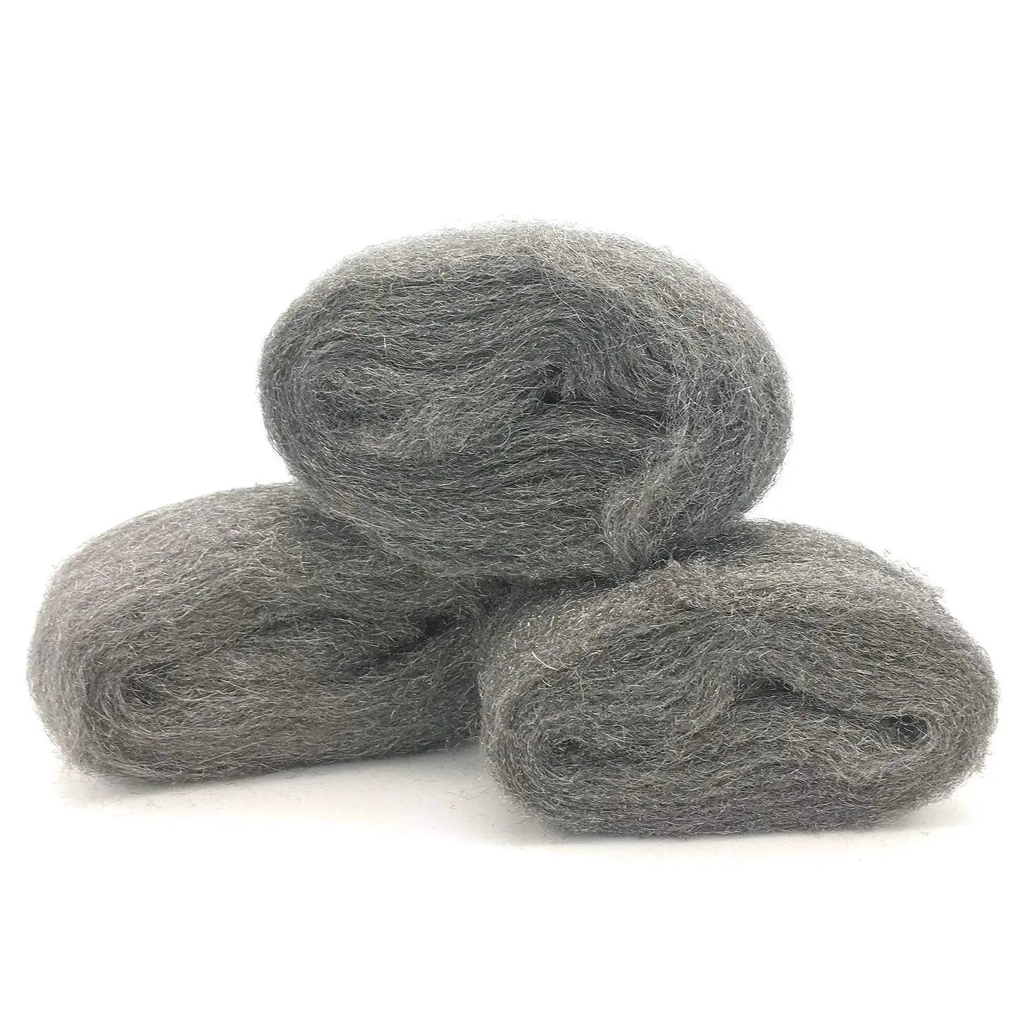 Three rolls of coarse steel wool fill fabric for mouse proofing homes displaying texture