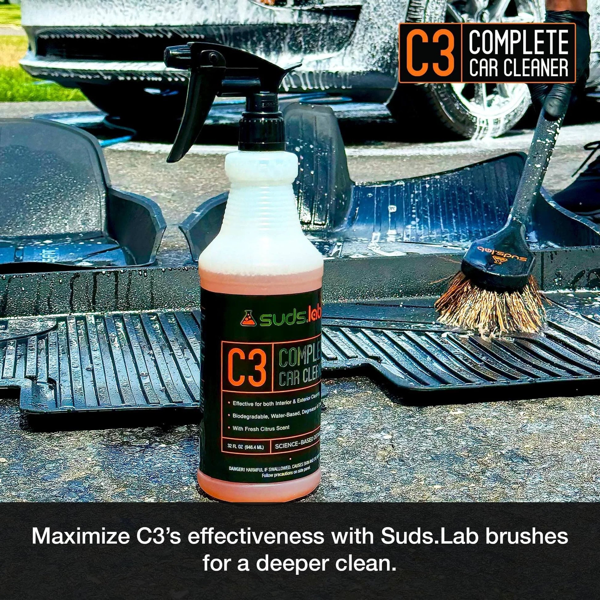 Suds Lab C3 Complete Car Cleaner bottle on car mat with brush, Multipurpose Car Wash Solution for Interior and Exterior Cleaning, 32 oz