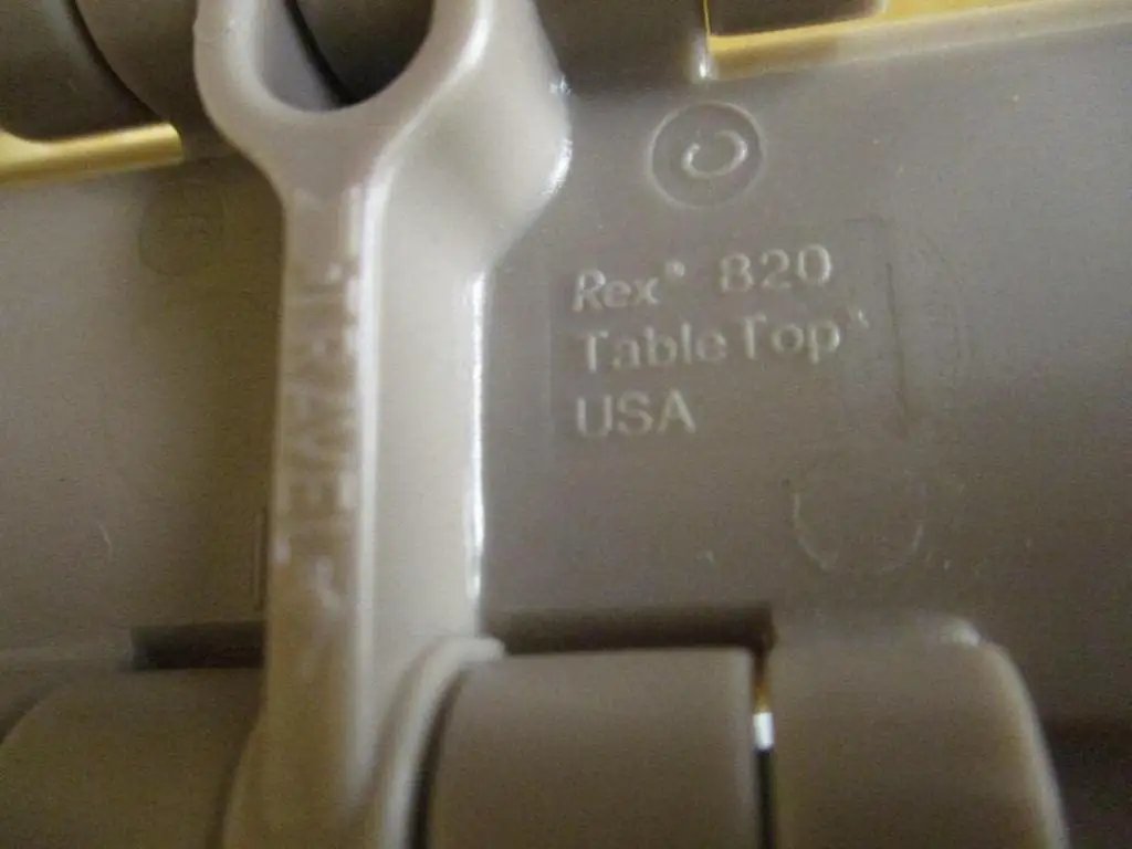 Close-up of Tabletop Industrial Chain By Rexnord With One And A Half Inch Pitch And Three Fourteenth Inch Width Tan Color Heavy Duty