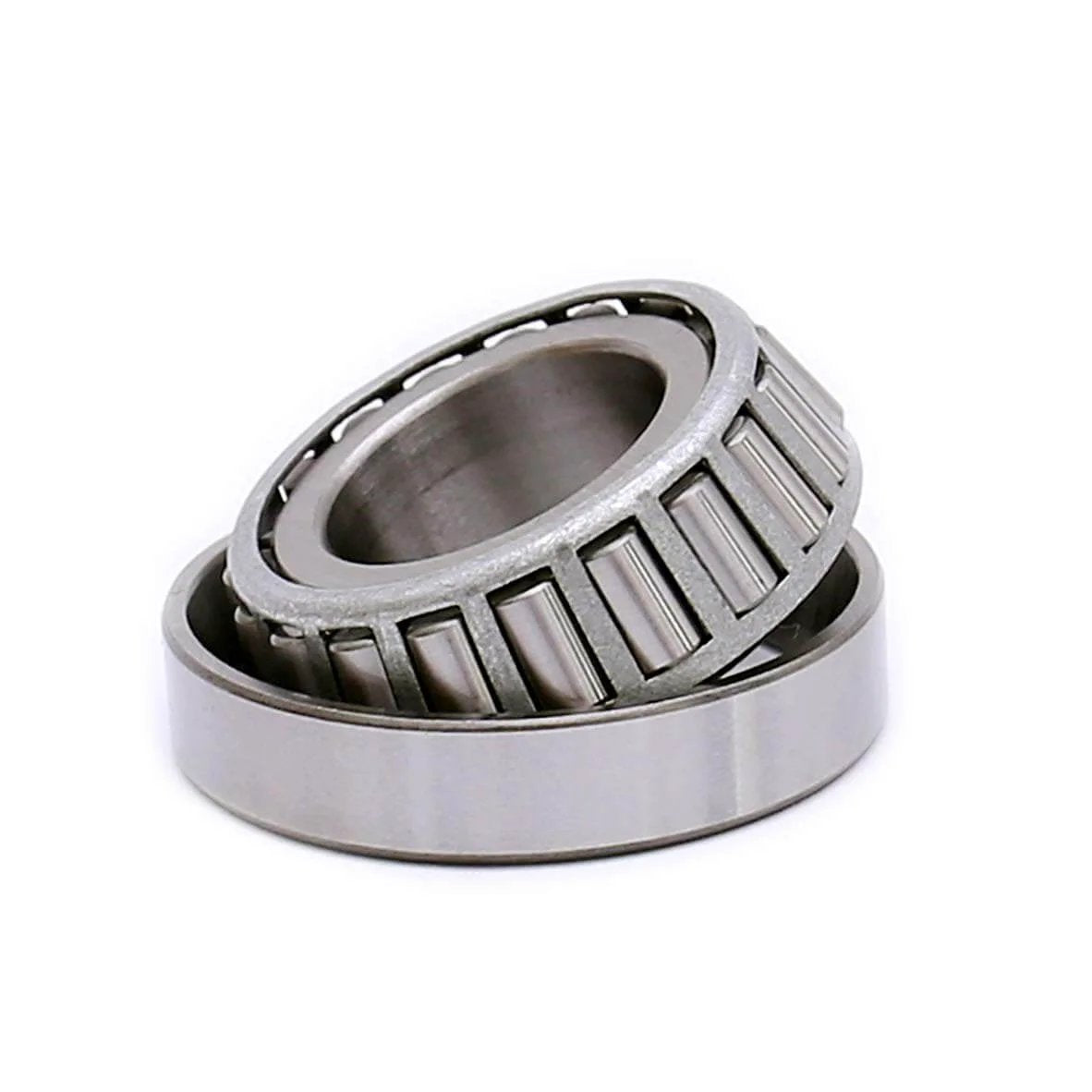 Close-up view of Tapered Roller Bearing LM67048 LM67010, Set of 4, showing inner and outer rings, metal construction.