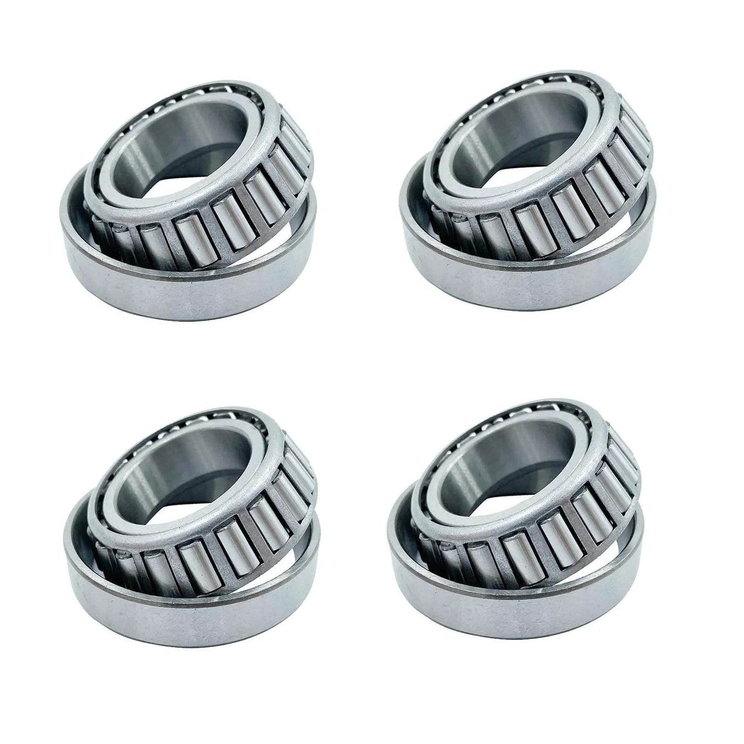 Four LM67048 LM67010, ID 1.250" x OD 2.328" SET6 tapered roller bearings arranged on a white background