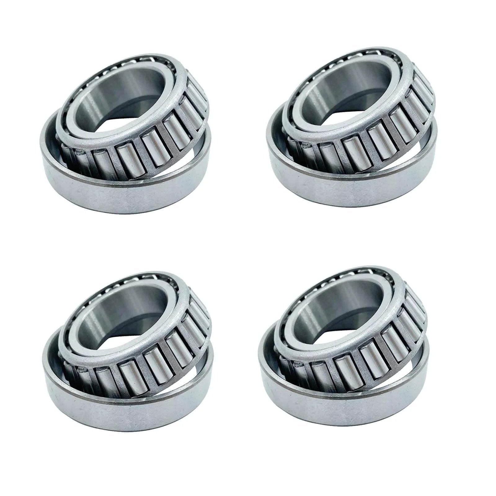 Four LM67048 LM67010, ID 1.250" x OD 2.328" SET6 tapered roller bearings arranged on a white background