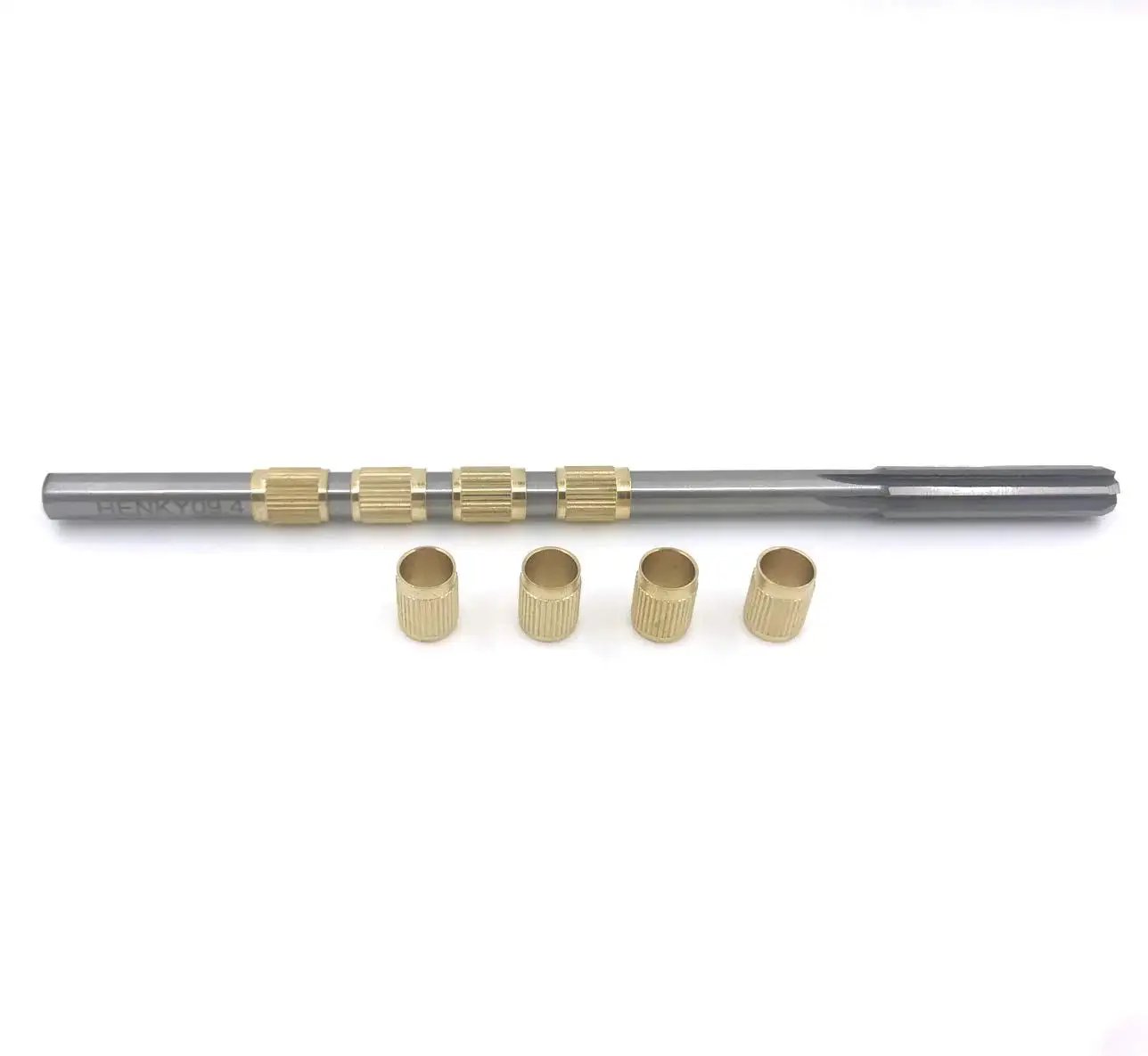 Throttle Shaft Bushing Repair Kit for Carburetors Five Sixteenth Shaft With Eight Brass Bushings and One Reamer on white background.