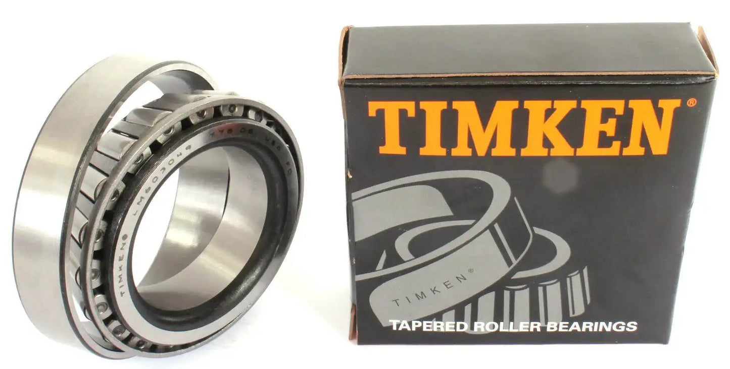 Two piece cone and cup tapered roller bearing set LM603049 LM603011 with packaging visible for automotive and industrial use