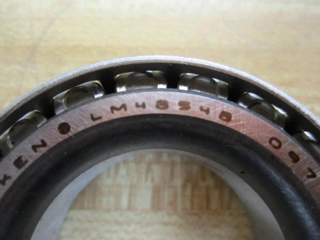 Close-up view of TIMKEN LM48548 Tapered Roller Bearing showing the engraved model number on the metallic surface