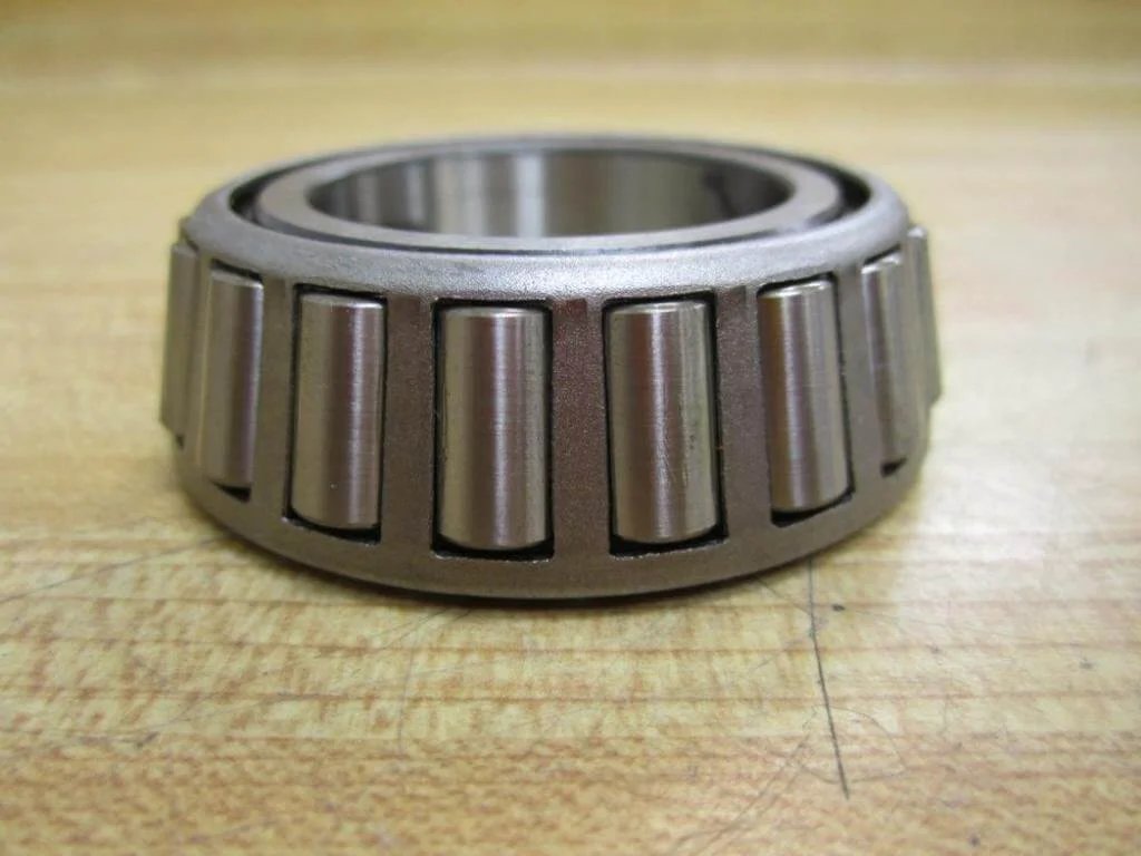 Side view of a TIMKEN LM48548 Tapered Roller Bearing showing metal rollers and inner cone.