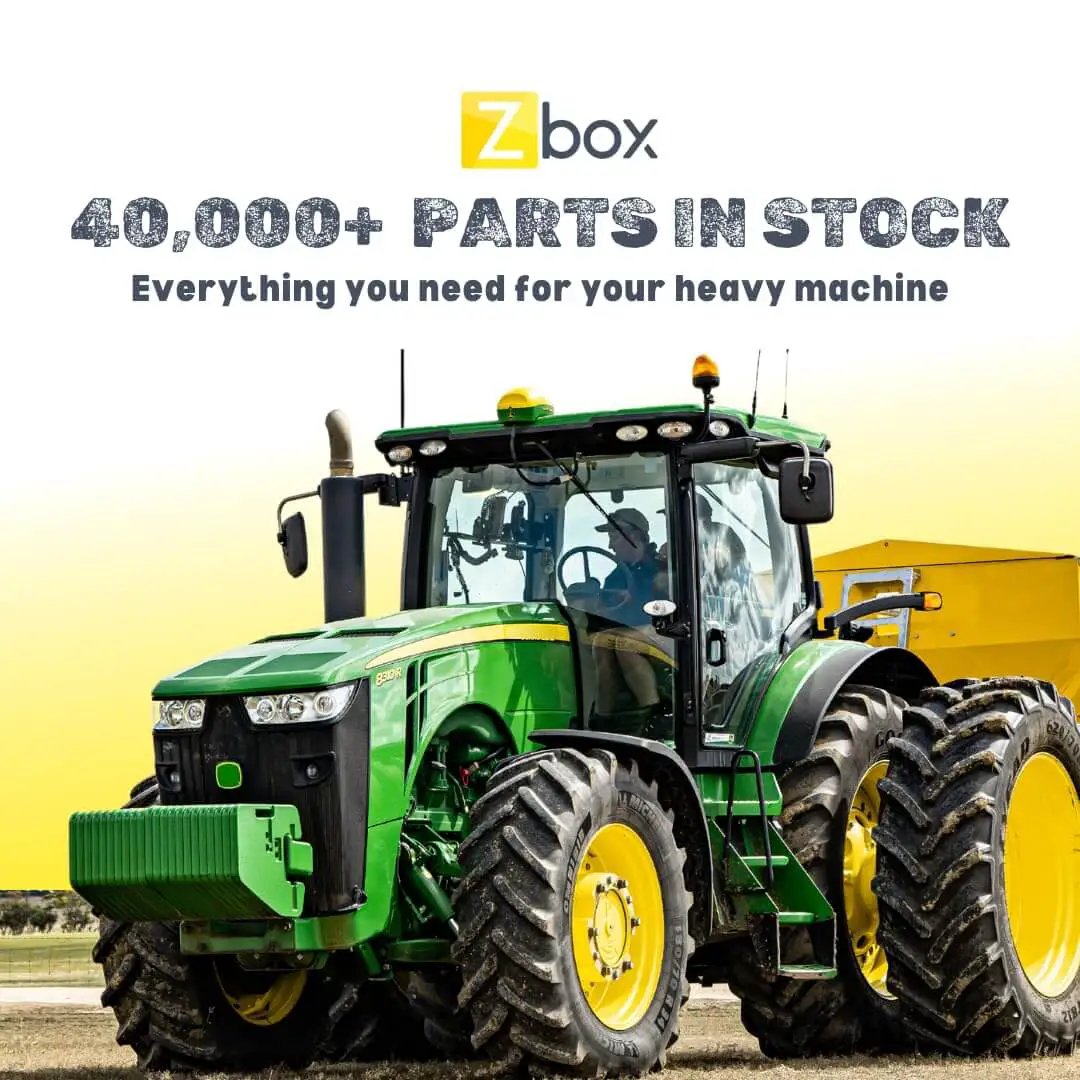 Green tractor in a field with text above advertising 40,000+ parts in stock from Zbox for heavy machinery.