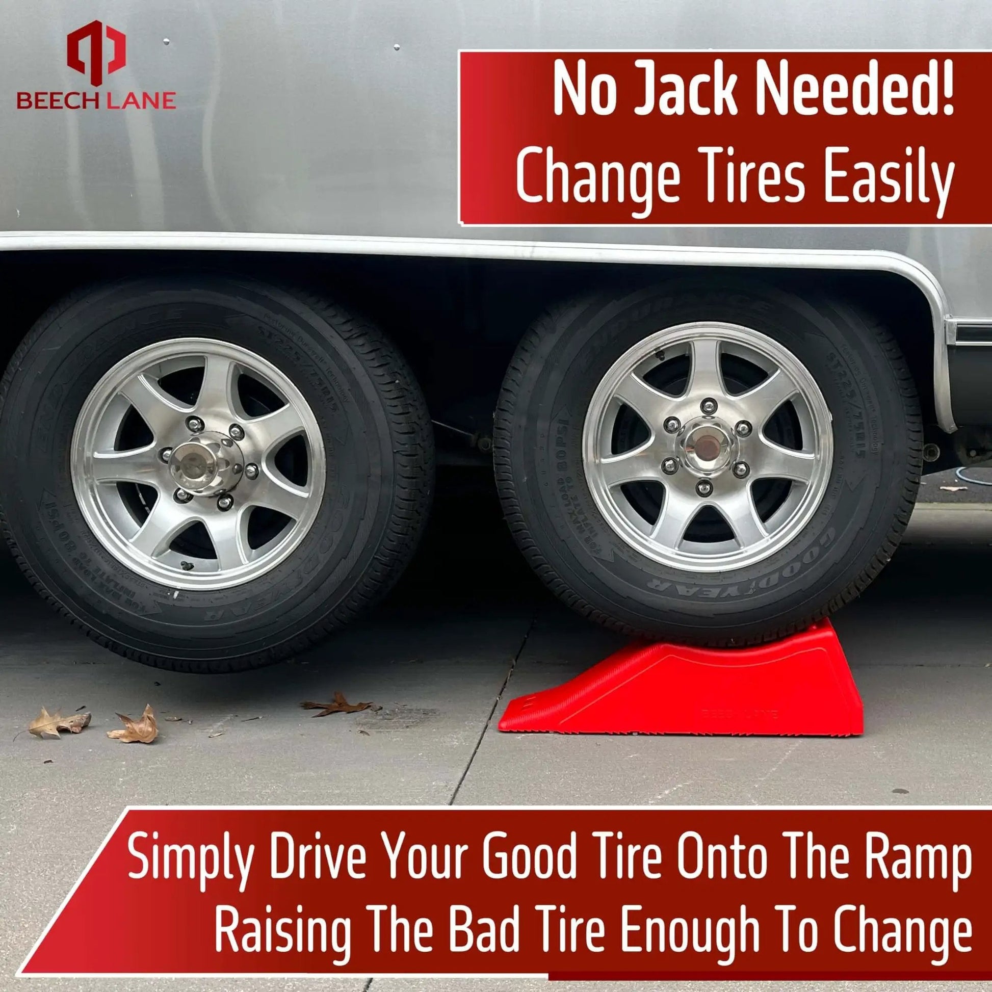Side view of a red Rugged Five And A Half Inch Lift Trailer Ramp for quick tire changes on dual axle trailers, under wheels.