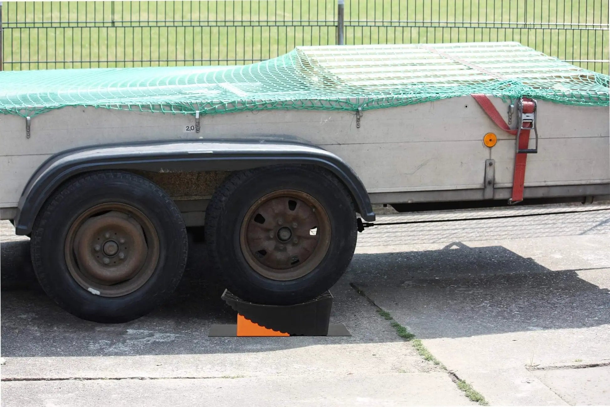 Raised Tire Change Ramp And Curved Leveling Blocks For RV And Trailer With Wheel Chock And Rubber Pad, 6 Inch Lift in use
