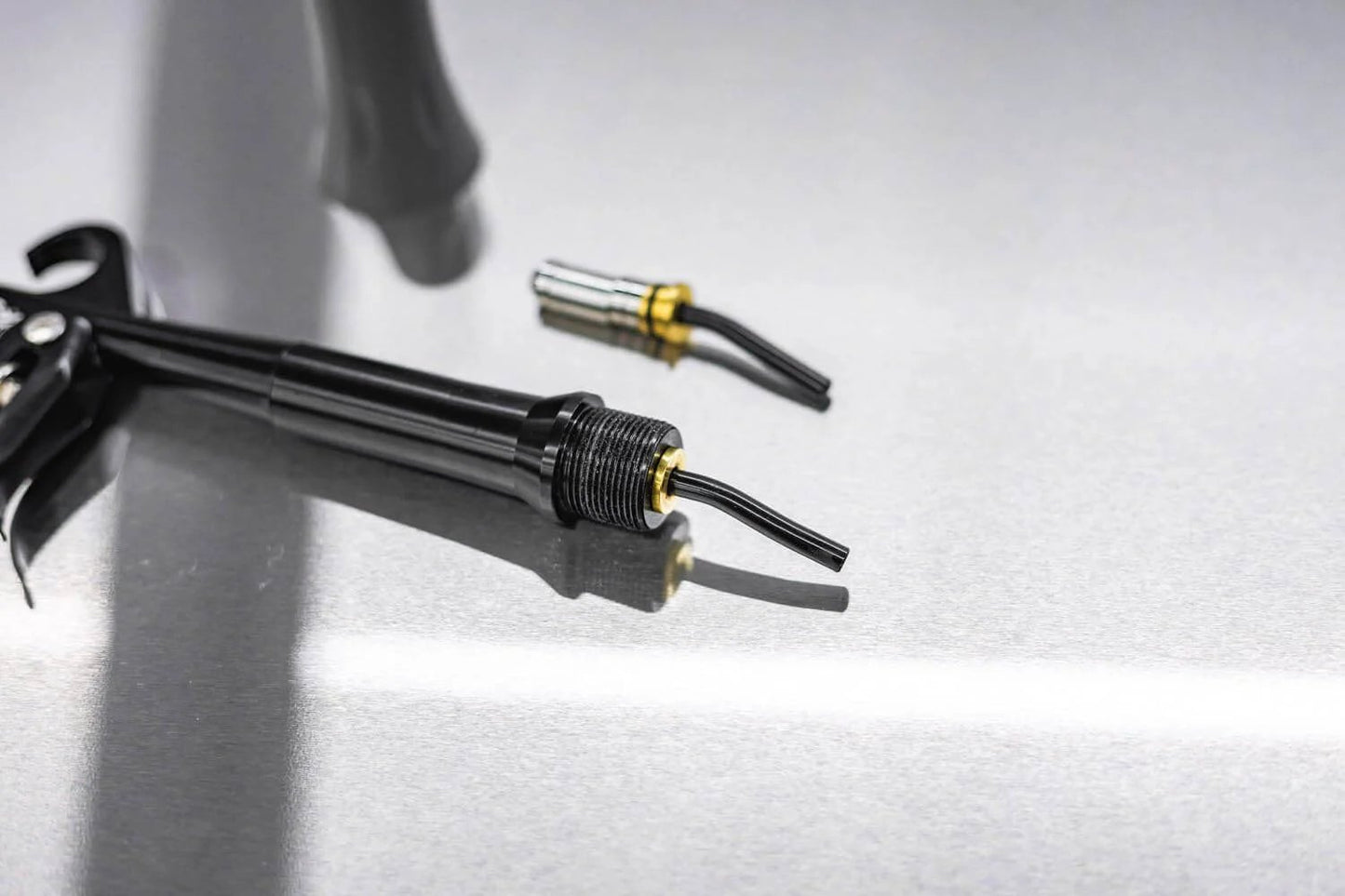 Close-up of Ultra Air Blaster Bearing Kit 2 Pack for Version 2 showing tool attachments on a reflective surface
