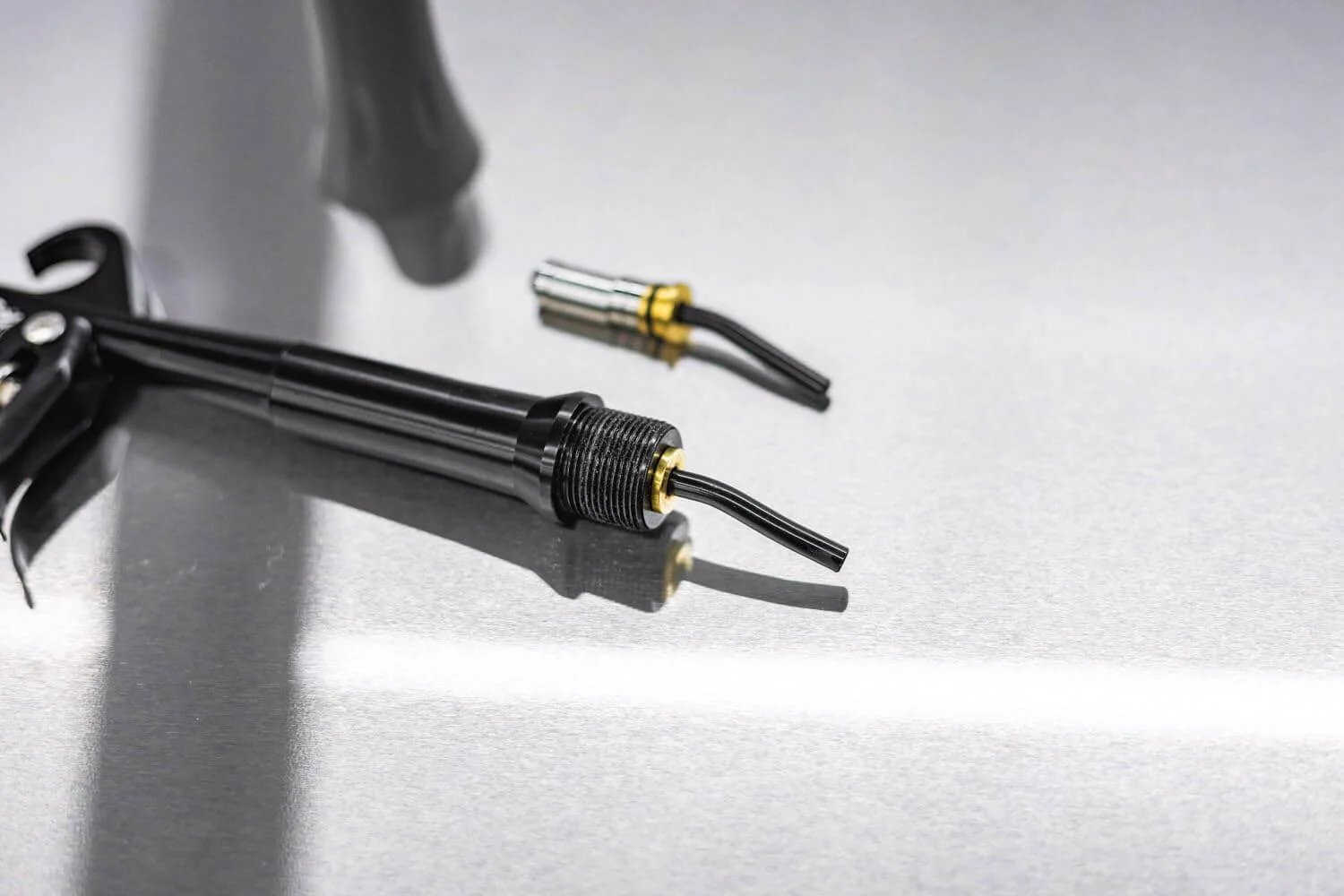 Close-up of Ultra Air Blaster Bearing Kit 2 Pack for Version 2 showing tool attachments on a reflective surface