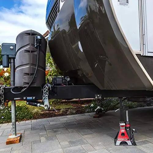 Trailer supported by 2 Ton UniJack Combination Hydraulic Bottle Jack And Jackstand In One Unit compact portable wide base