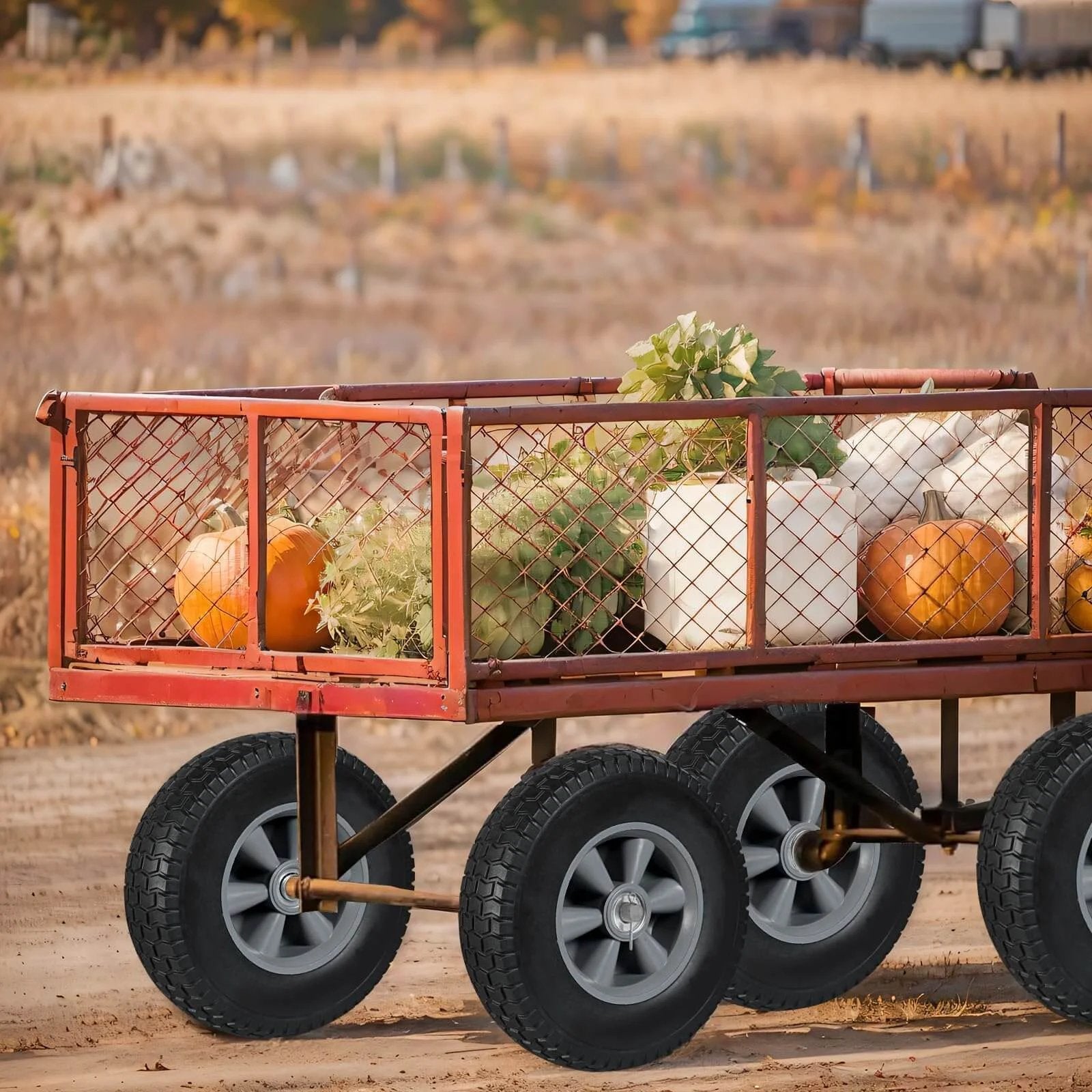 Utility cart with solid rubber tires and wheels, 10 inch flat free tubeless wheels, 5/8" axle bore hole, carrying pumpkins in a field