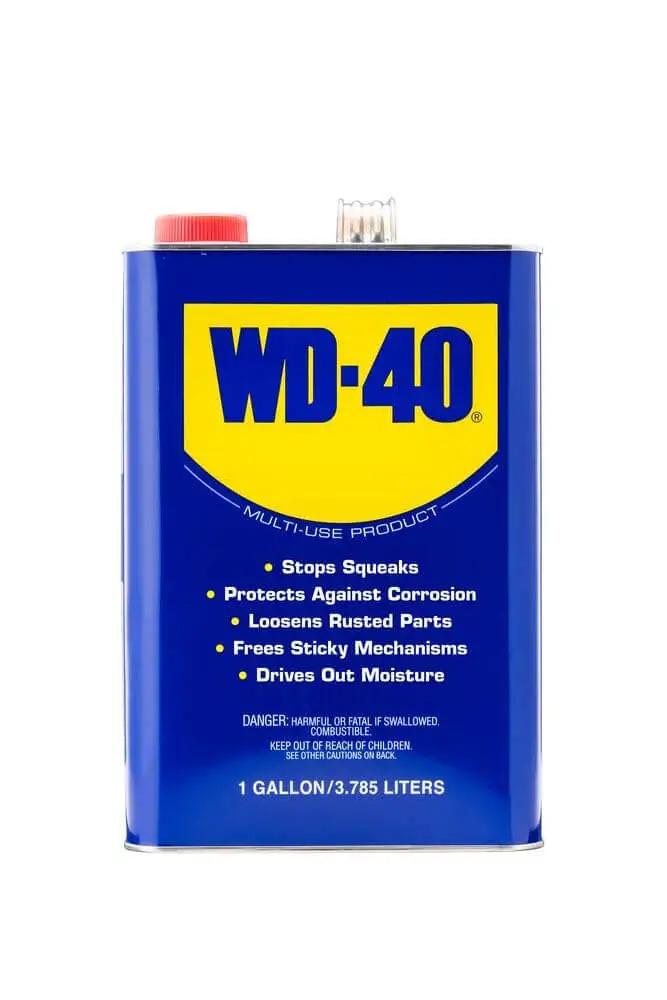 Heavy Duty Multipurpose Lubricant Spray For Tools And Equipment That Cleans Grease Grime And Dirt Penetrates Stuck Parts Displaces Moisture Prevents Rust And Corrosion Degreases Tar And Adhesives In A 1 Gallon Can From The Trusted WD-40 Brand