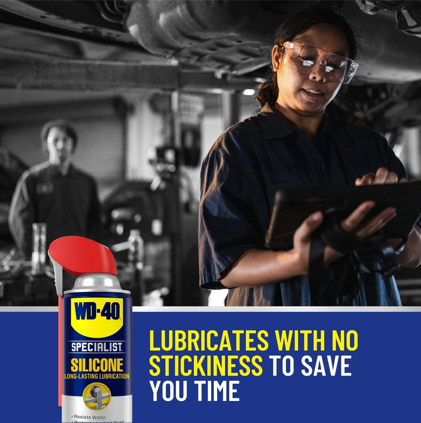 Mechanic using WD-40 Specialist Silicone Lubricant with SMART STRAW SPRAYS 2 WAYS, 11 OZ, in a workshop setting