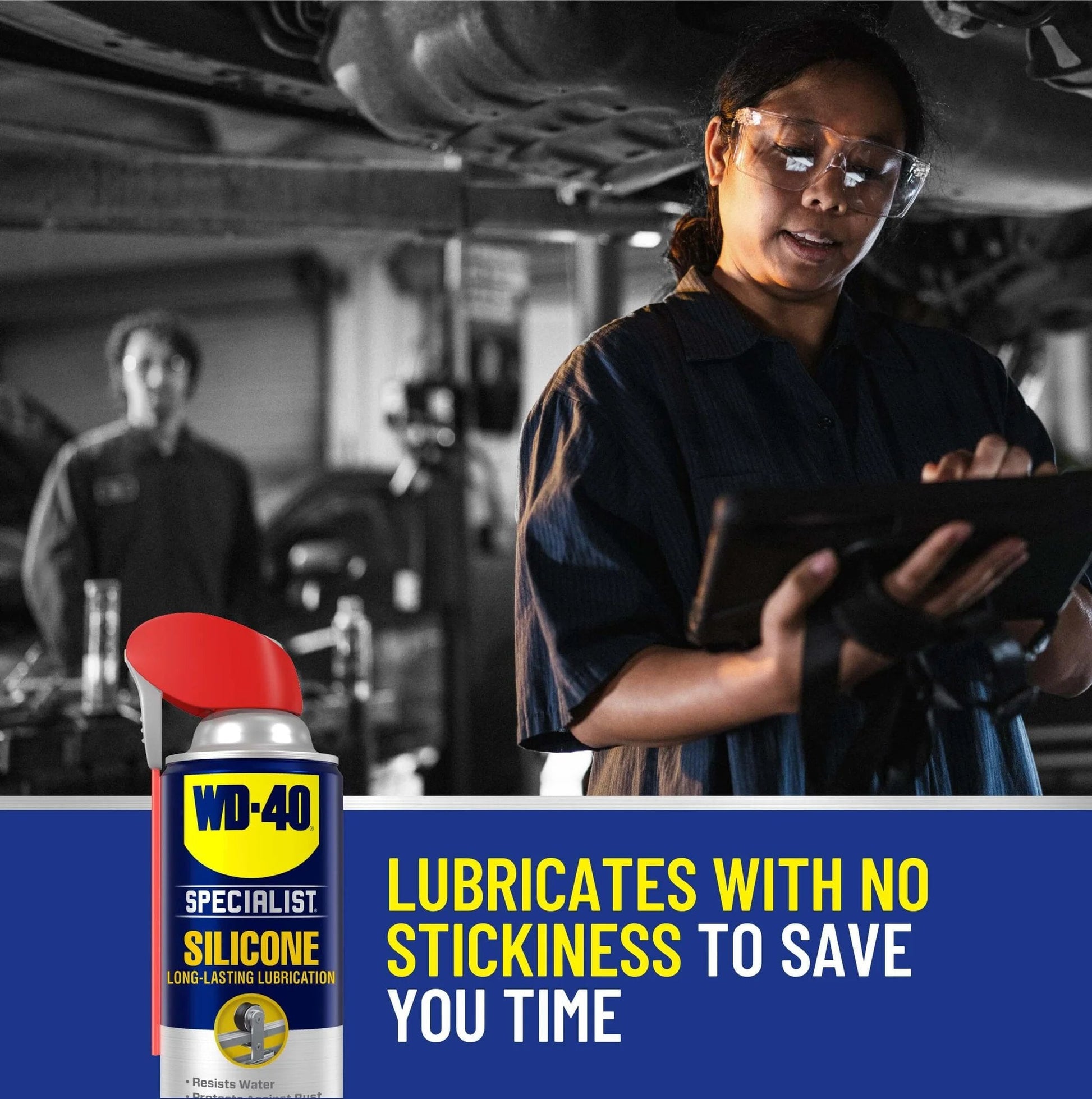 Mechanic using WD-40 Specialist Silicone Lubricant with SMART STRAW SPRAYS 2 WAYS, 11 OZ, in a workshop setting