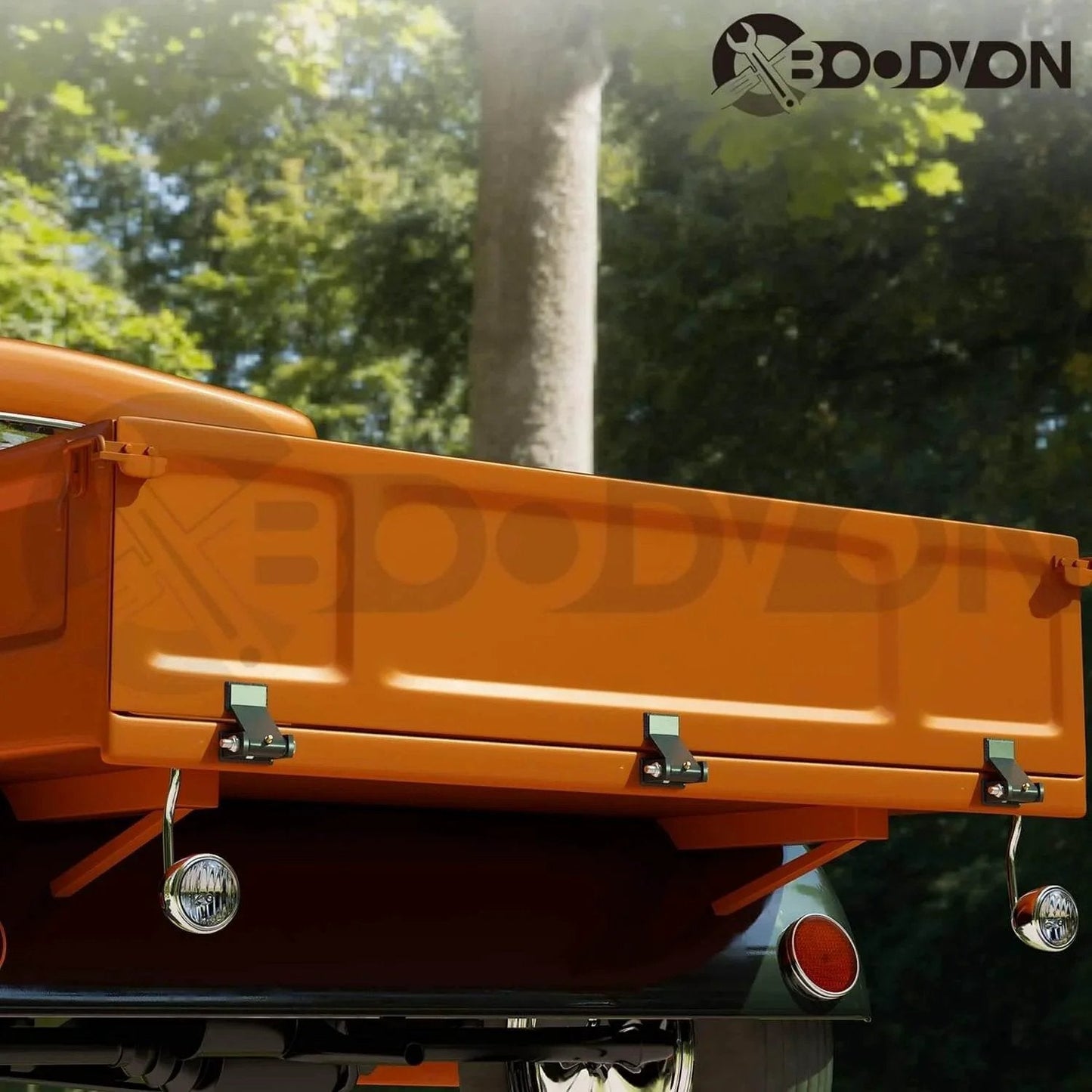 Rear view of a truck with Weld On Trailer Hinges With Grease Fitting Short Leaf Heavy Duty Dump Trailer Hinges installed.