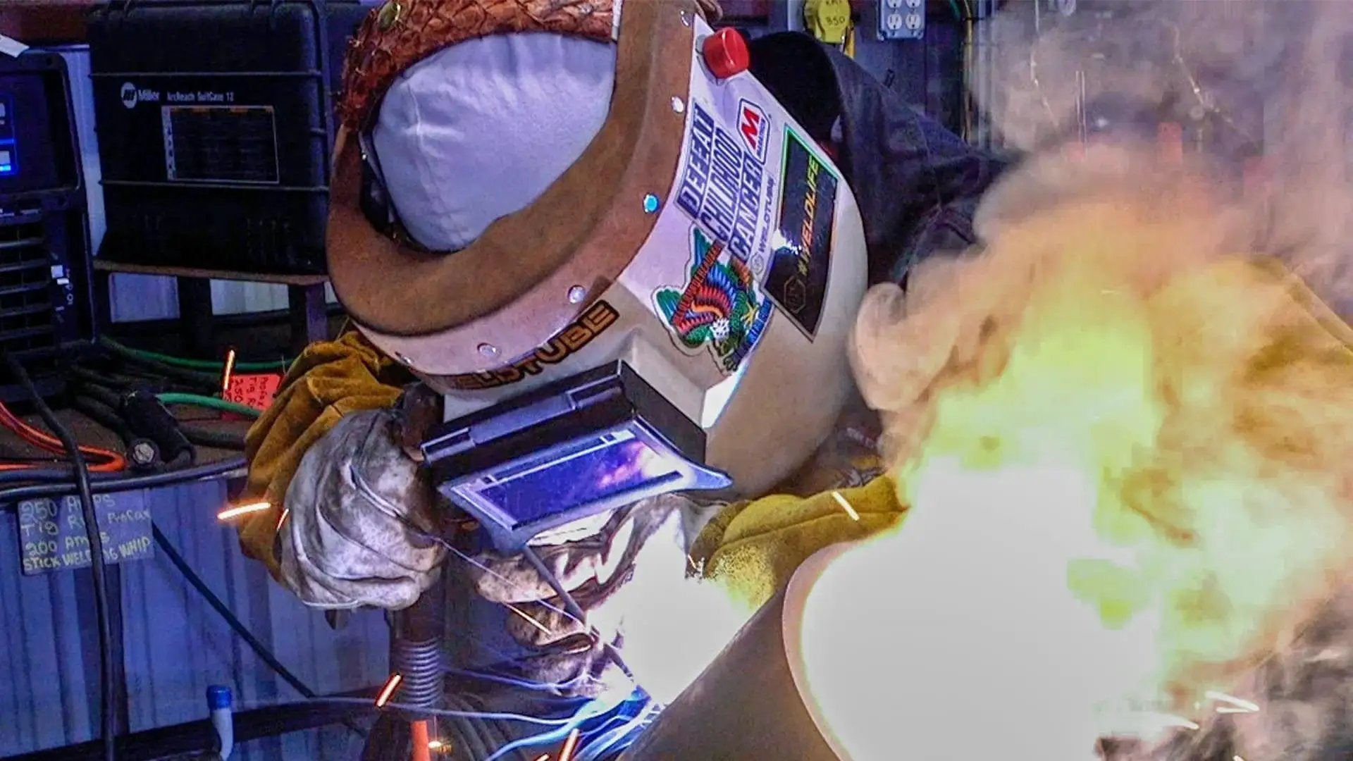 Welder using Flip Front Clip On Adapter for Pipeliner welding helmet, showcasing the quick attach shield in action during a metalwork task.
