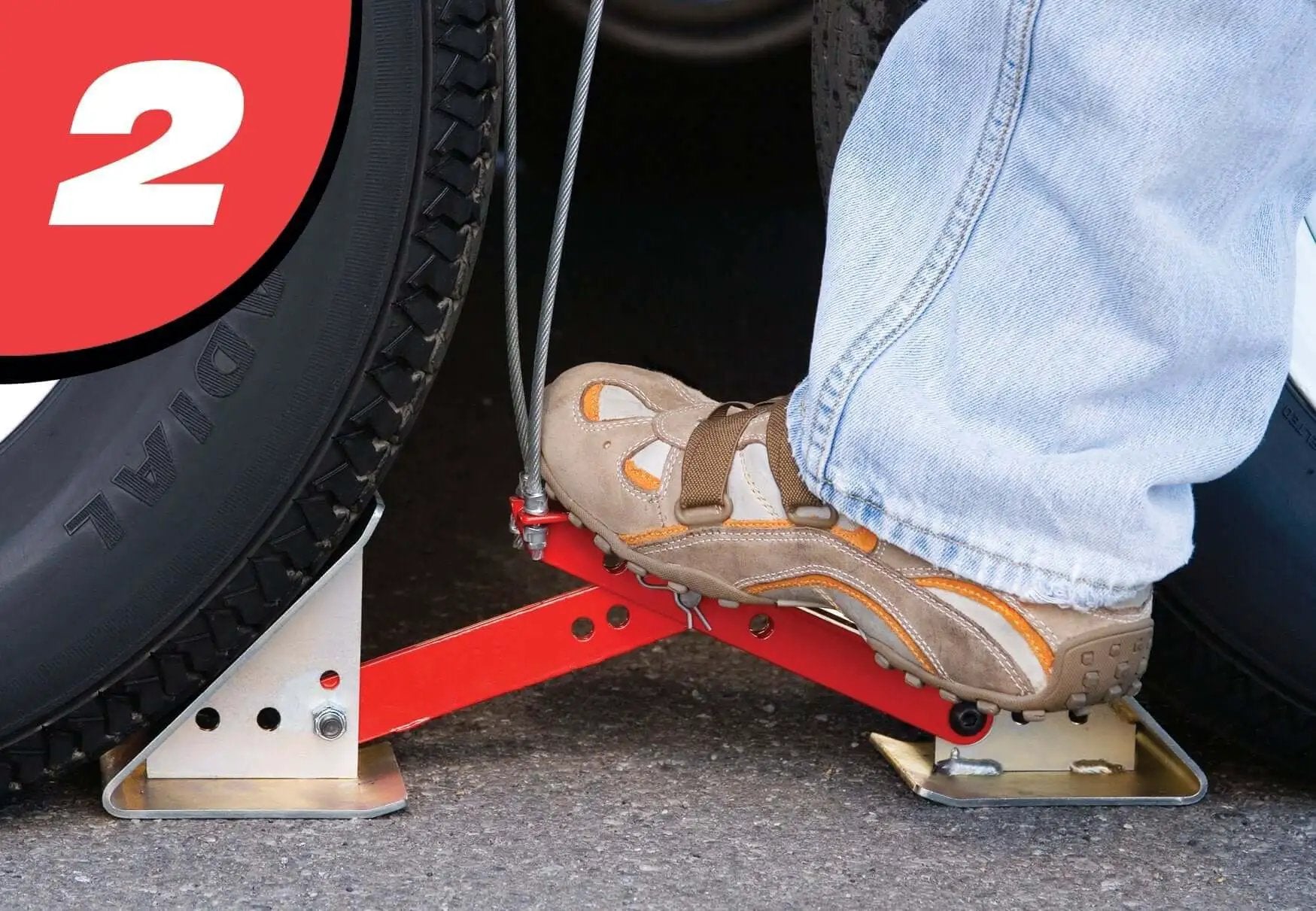 Foot installing OneStep Wheel Chock Double Pack For Tandem Axle Trailers And RVs, 16 to 24 Inch Long, no kneeling required