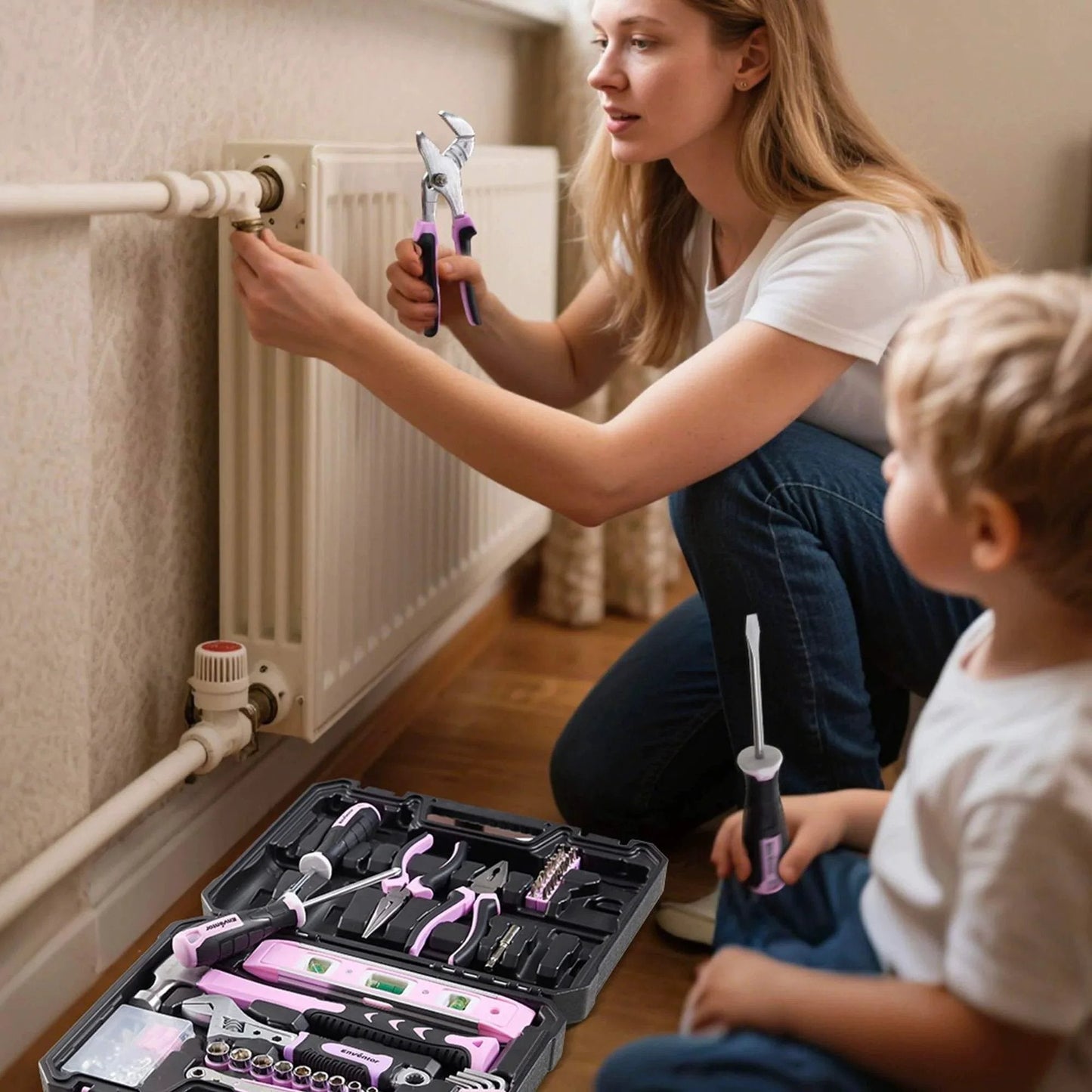 Woman using Pink Tool Kit for Women 146 Piece General Household Hand Tools Storage Toolbox for home radiator repair with child.
