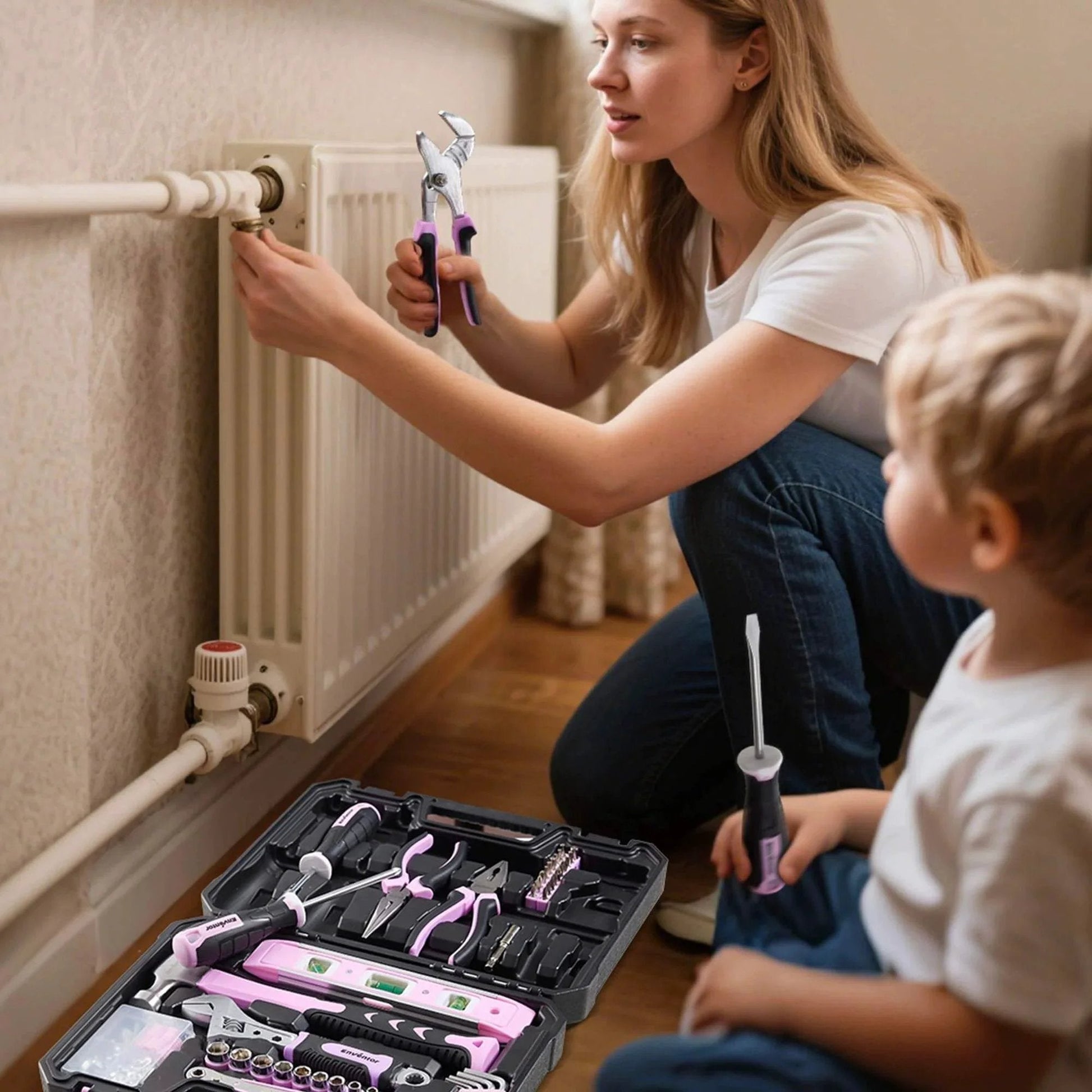 Woman using Pink Tool Kit for Women 146 Piece General Household Hand Tools Storage Toolbox for home radiator repair with child.