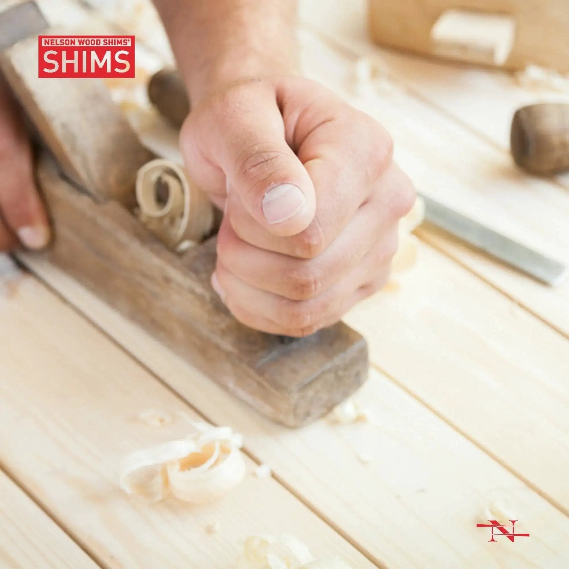 Hand using a plane to smooth wood surface with Nelson Wood Shims logo, relating to Versatile 8 Inch Wood Shims Set For DIY Projects And Home Improvement By Nelson, 24 Pack Delivers Easy Leveling And Spacing For Cabinets, Doors, Floors, Tables, Appliances, Stairs, And More, Trusted For Quality And Longevity.