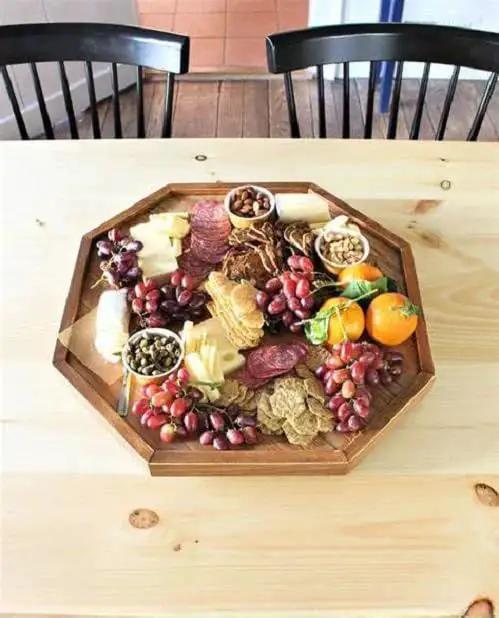 Charcuterie board with meats, cheeses, nuts, and fruits on a 12-inch Lazy Susan Base Only For Glass Granite Or Wood Tables Heavy Duty Aluminium Alloy Rotating Turntable.