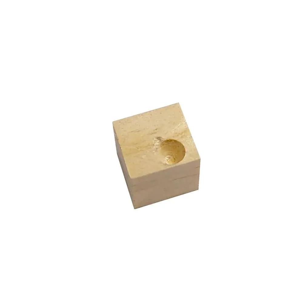 Wooden block with carved hole viewed from above on white background